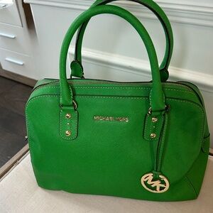 Michael Kors medium Green zip top Satchel with gold accents.
